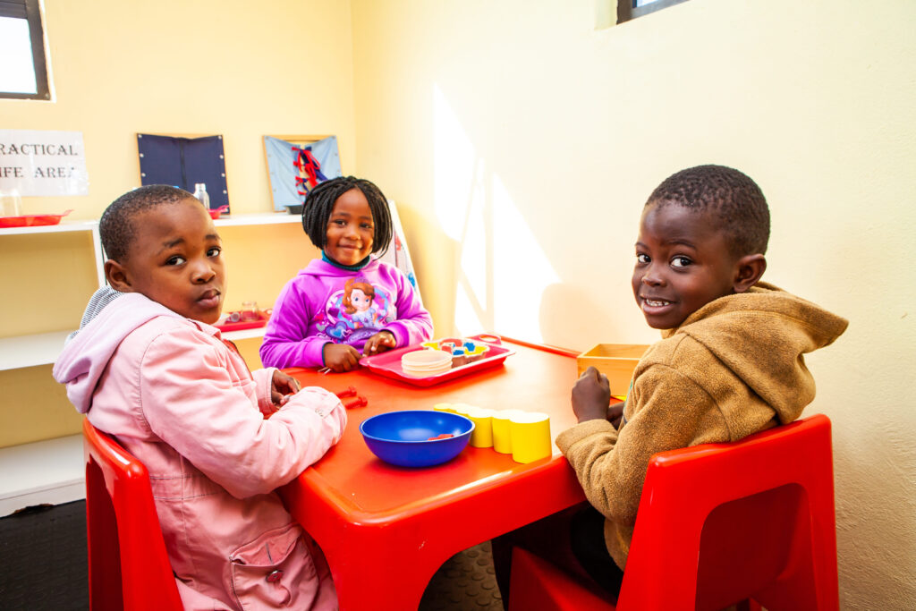 Children playing with Montessori toys