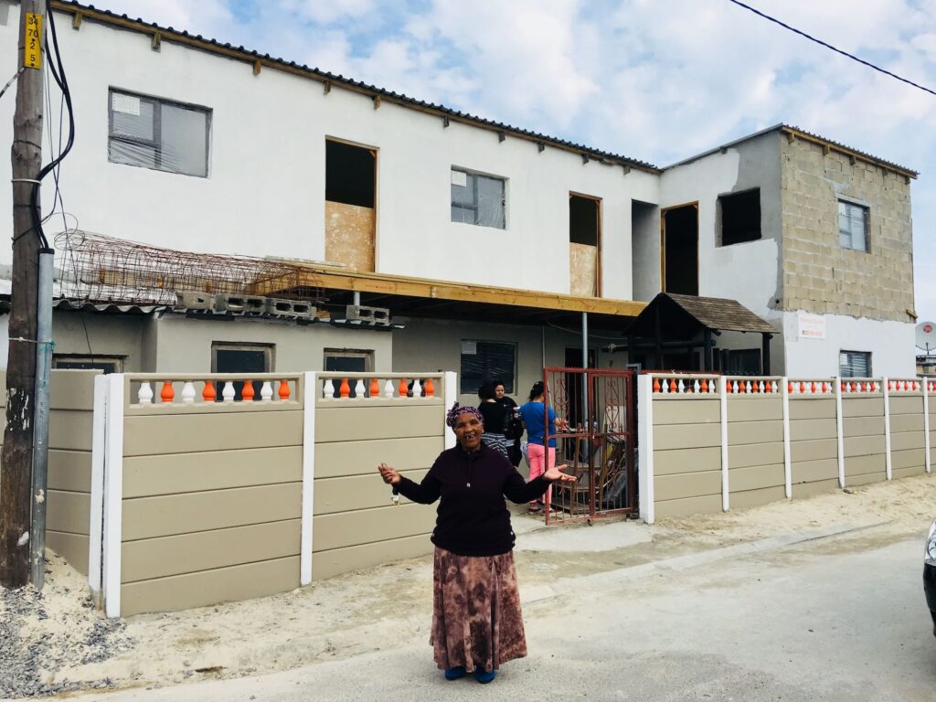 Ntsiki in front of the new preschool building