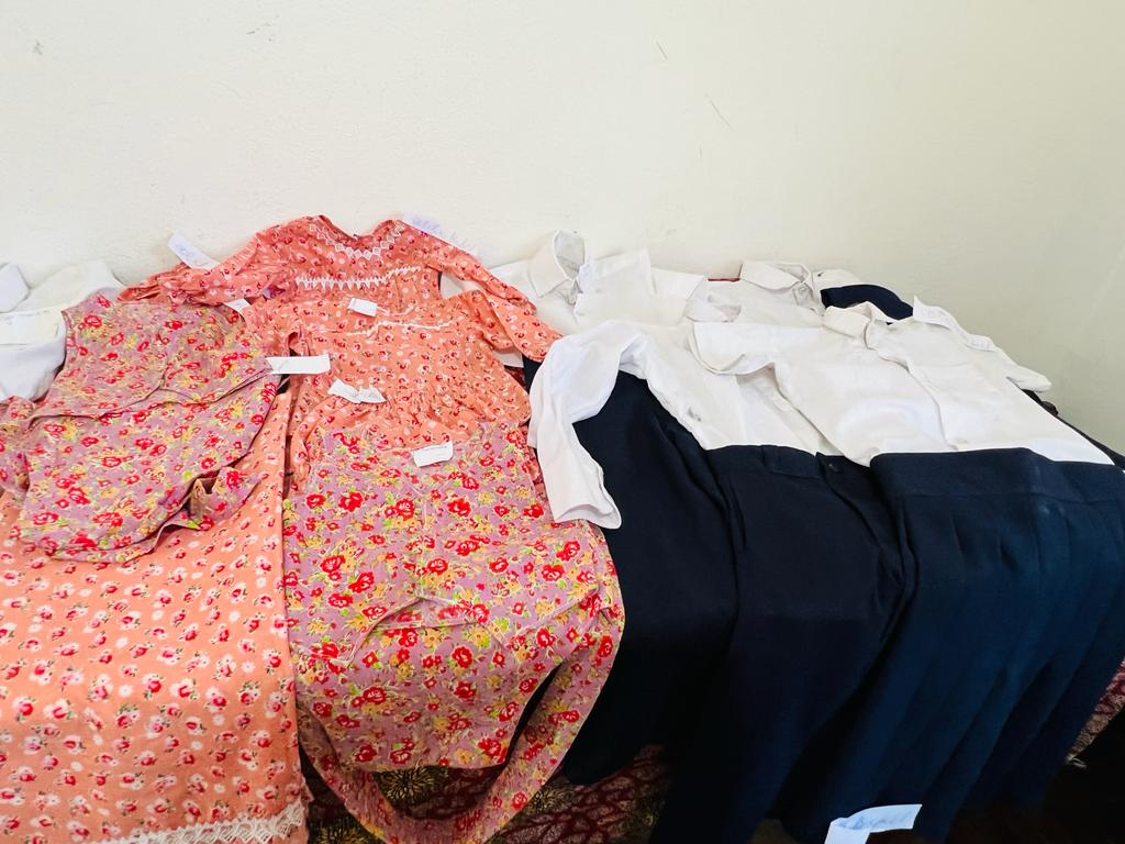 Clothes made by sewing school graduates
