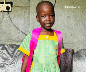 Loice in her school uniform