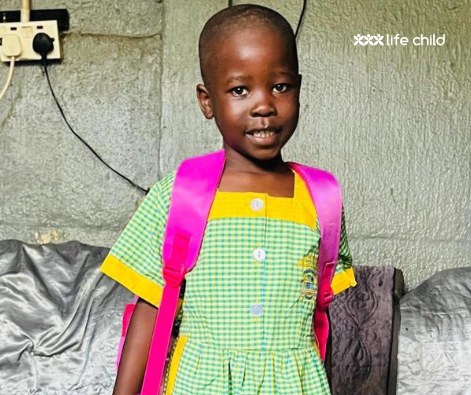 Loice in her school uniform